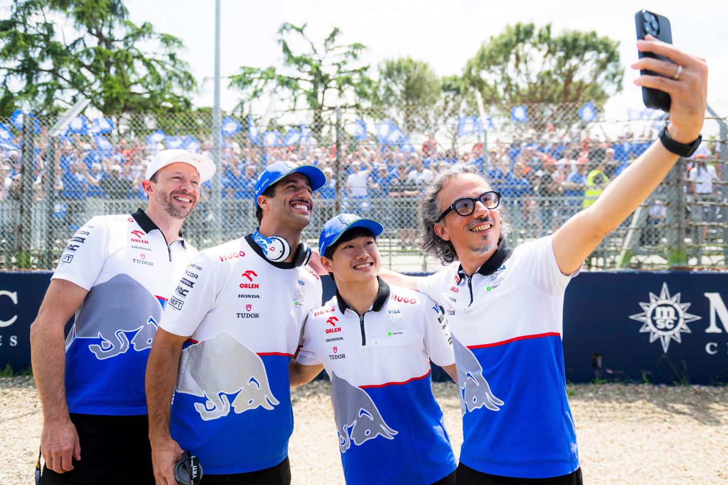 IMOLA, ITALY - MAY 19: Peter Bayer, CEO of Visa Cash App RB, Daniel Ricciardo of Australia and Visa